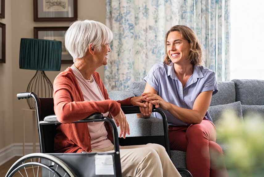 Senior-woman-enjoying-company-of-caregiver
